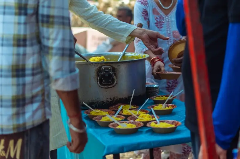 Food distribution for underprivileged families through the ashram community kitchen