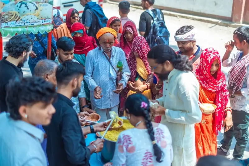 Volunteers serving fresh meals to the community at Samadhi Yoga Ashram