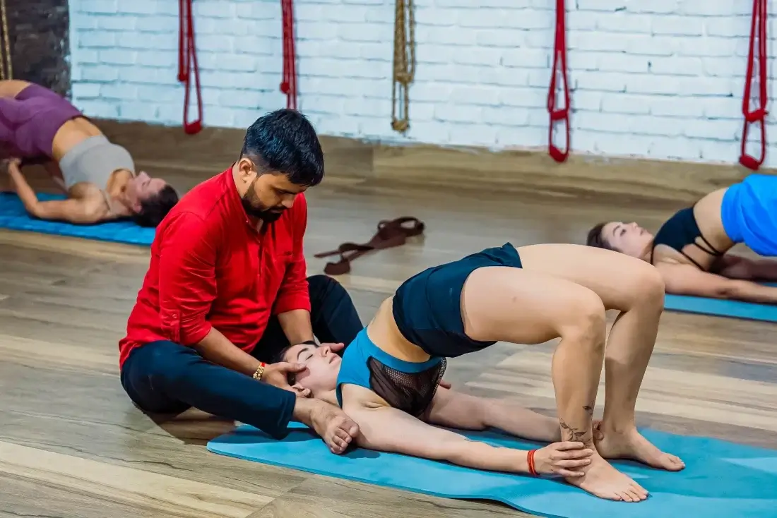  yoga teacher and students